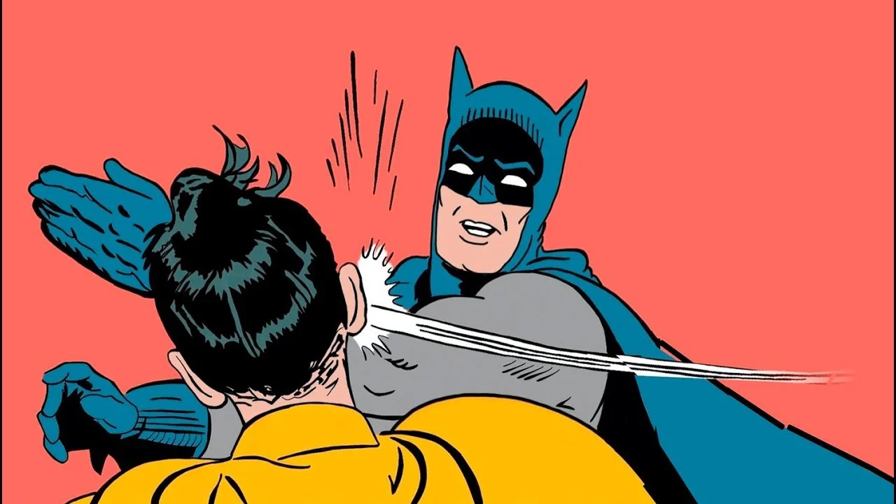 batman abofeteando robin